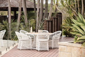 havana white synthetic wicker and round outdoor teak table setting