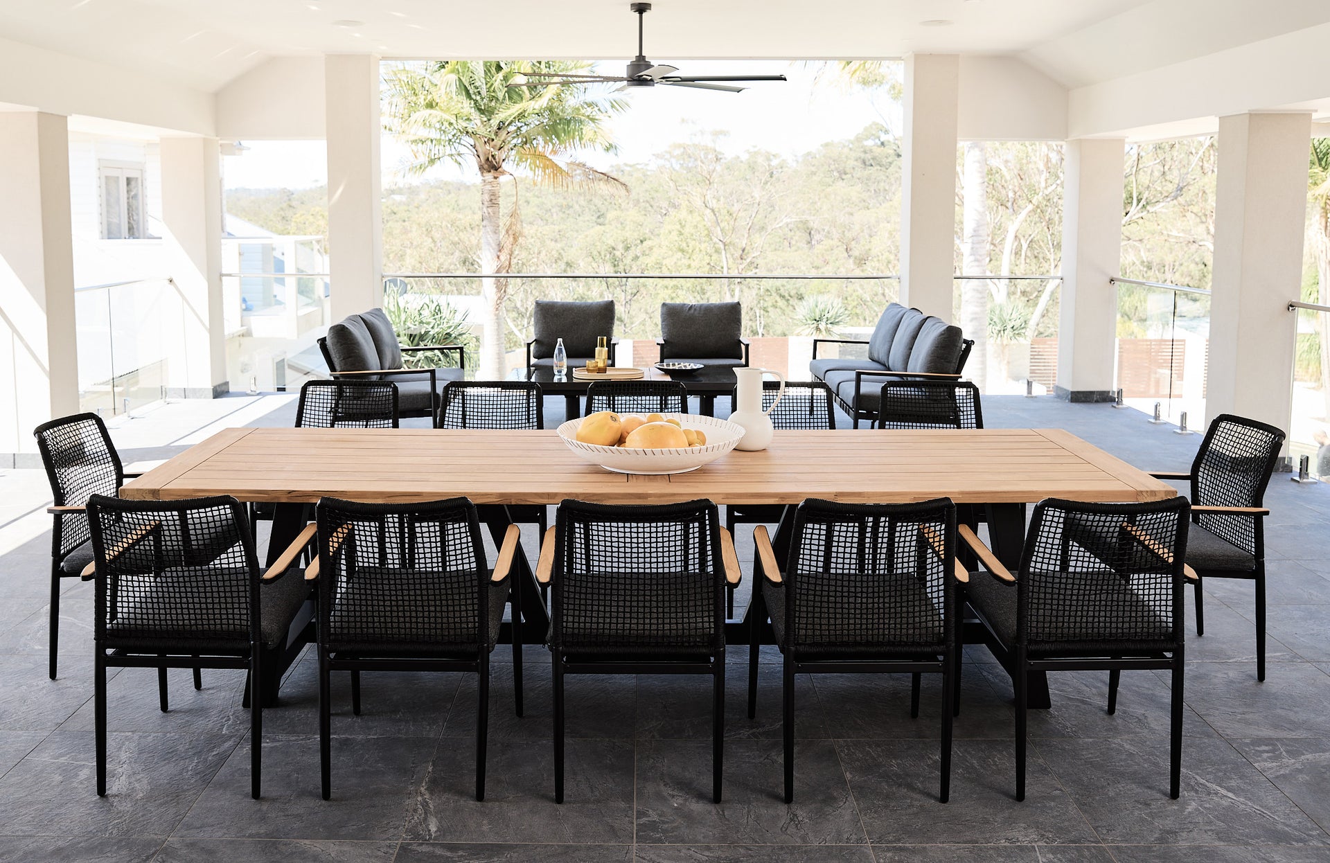 Daytona_Outdoor_Dining_Table_Teak_Top_Alum_legs_with_Santiago_Arm_Chairs_Rope_in_Black_and_Santiago_Sofa_Setting_in_Black_1