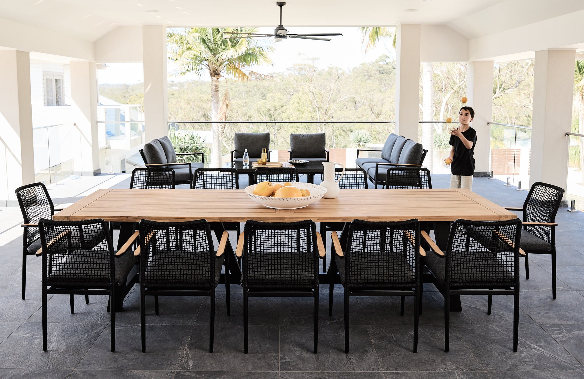 Daytona_Outdoor_Dining_Table_Teak_Top_Alum_legs_with_Santiago_Arm_Chairs_Rope_in_Black_and_Santiago_Sofa_Setting_in_Black_3_b11fa82c-144d-4da2-9744-5c2b61c8d6ef