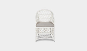 white wicker outdoor dining chair