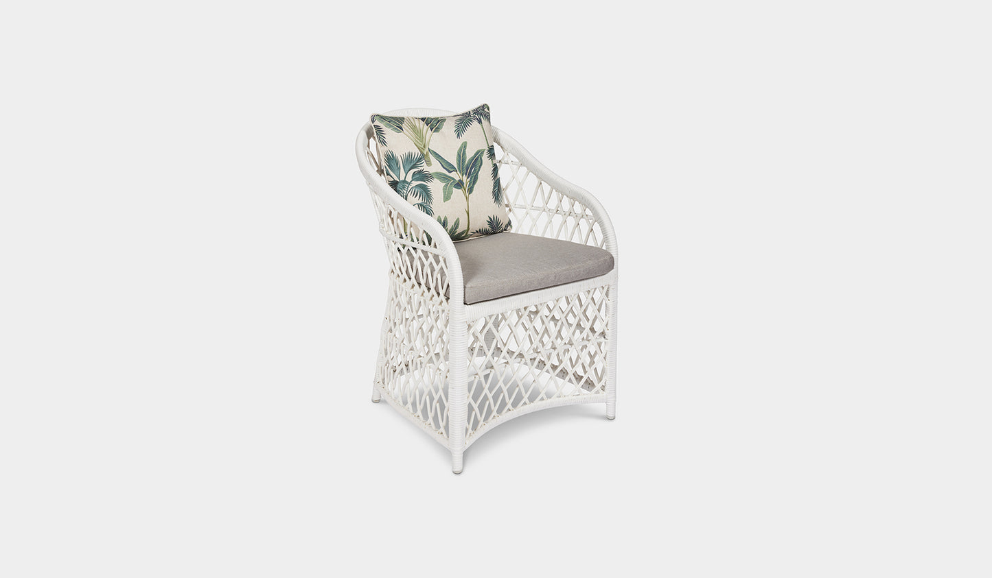 white wicker outdoor dining chair