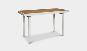 white outdoor bar table with teak