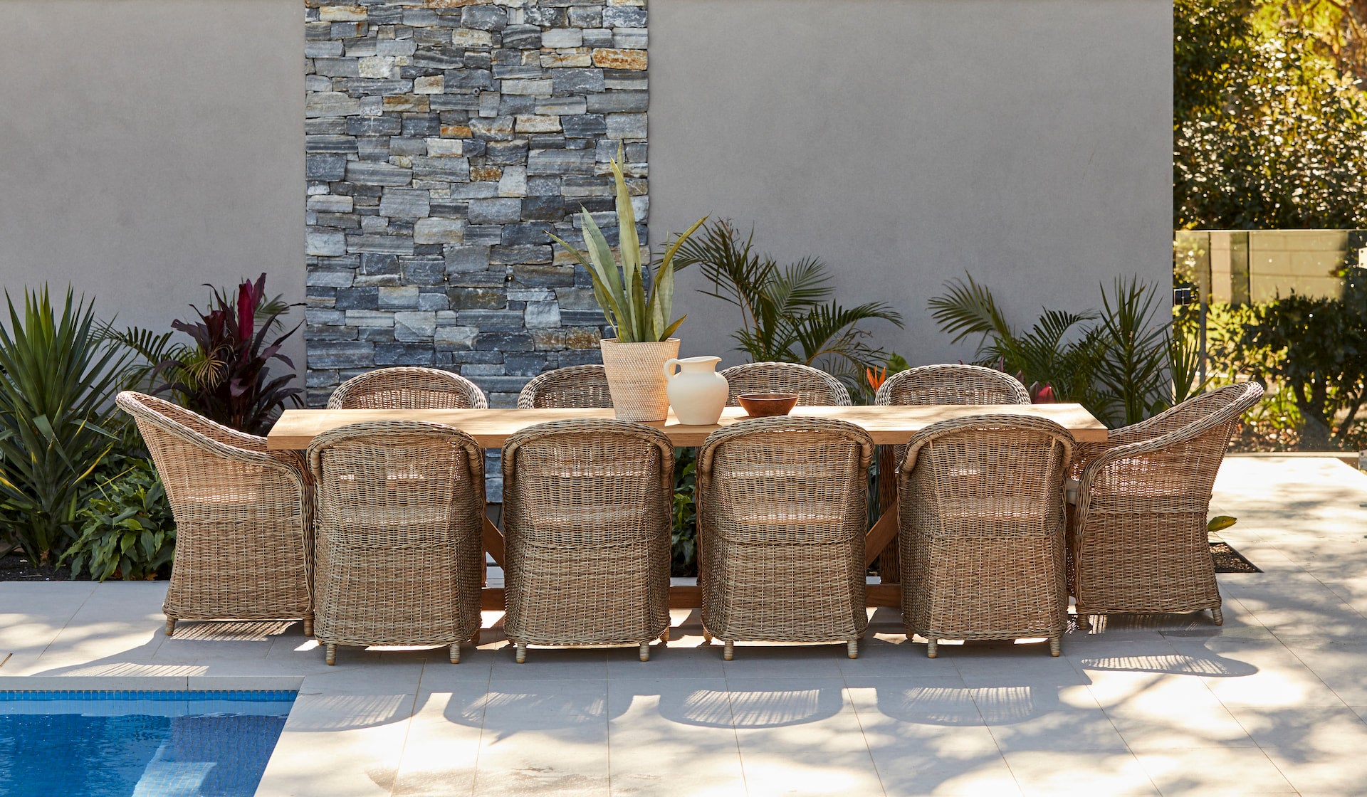 vinegard reclaimed teak table with synthetic wicker dining chairs