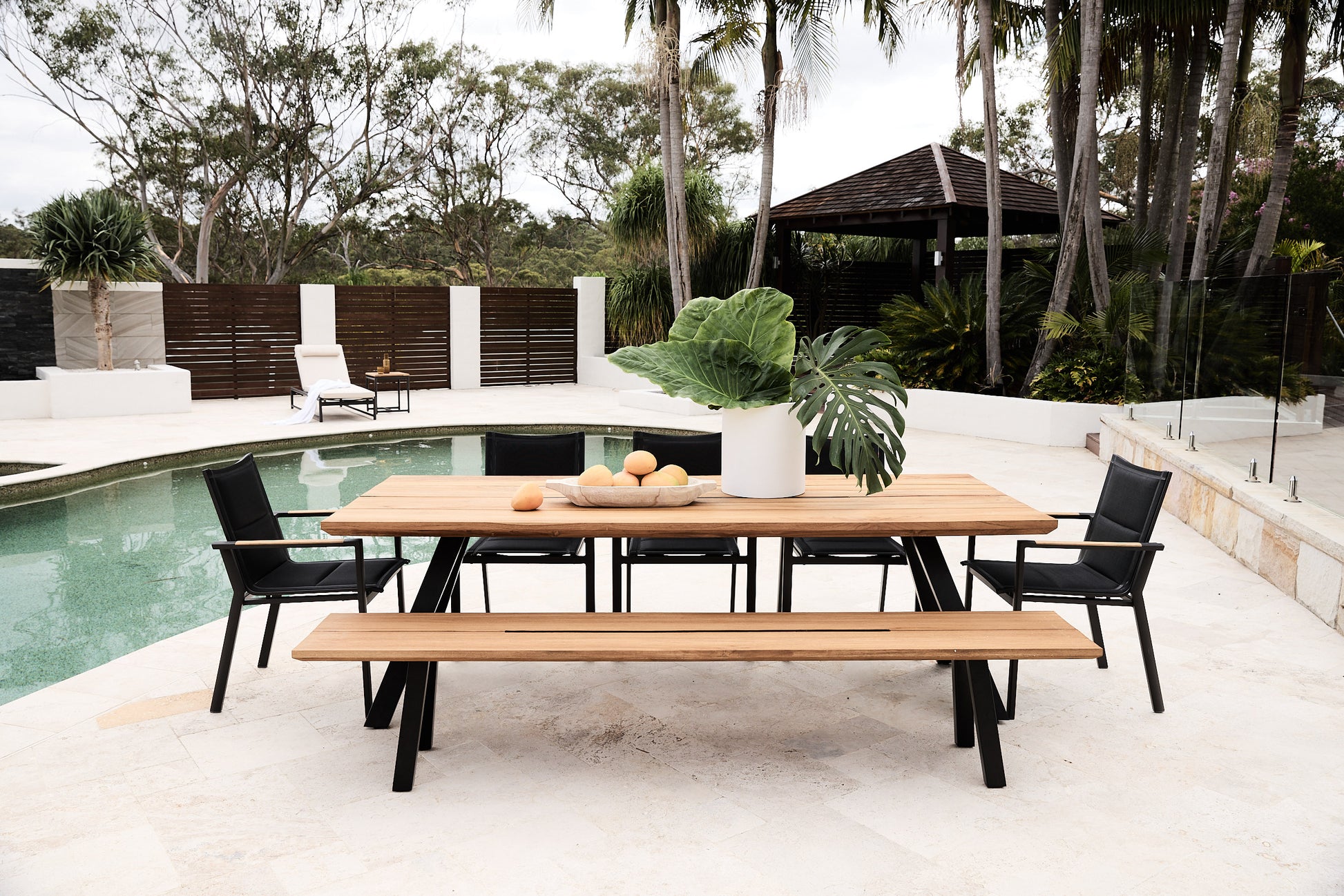 reclaimed look a like rockdale table with bench and black arm chairs