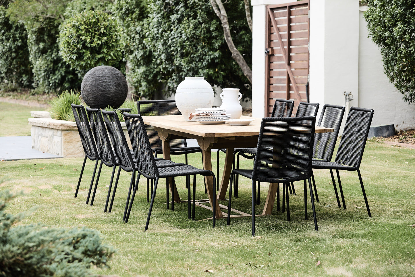 Arubra rope Outdoor Stackable Dining Chair around teak table