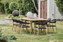 Load image into Gallery viewer, teak outdoor extension table with black rope arm chairs