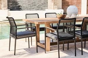 vinegard reclaimed teak outdoor table with black rope chairs