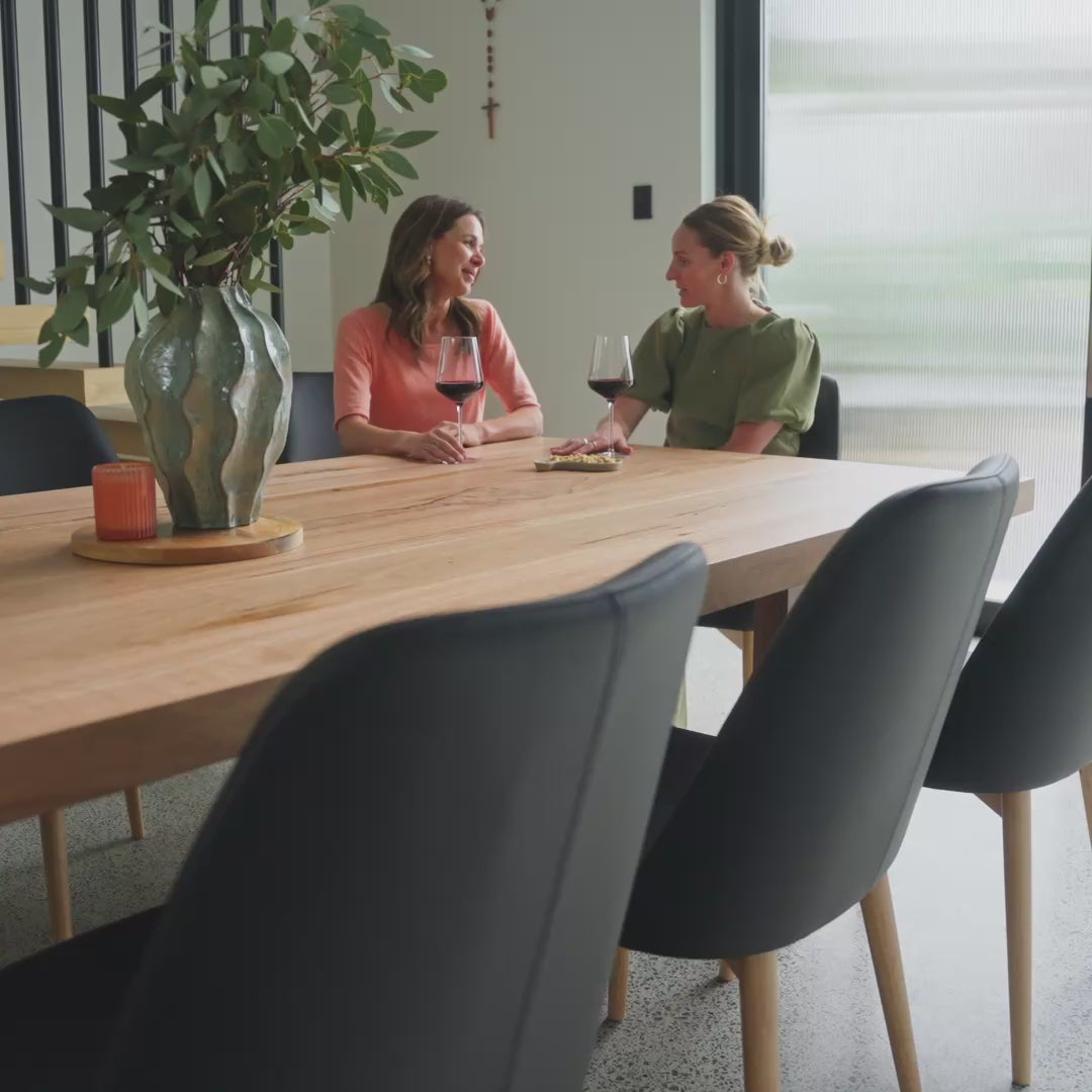 lifestyle video indoor solid messmate dining table and leather chairs