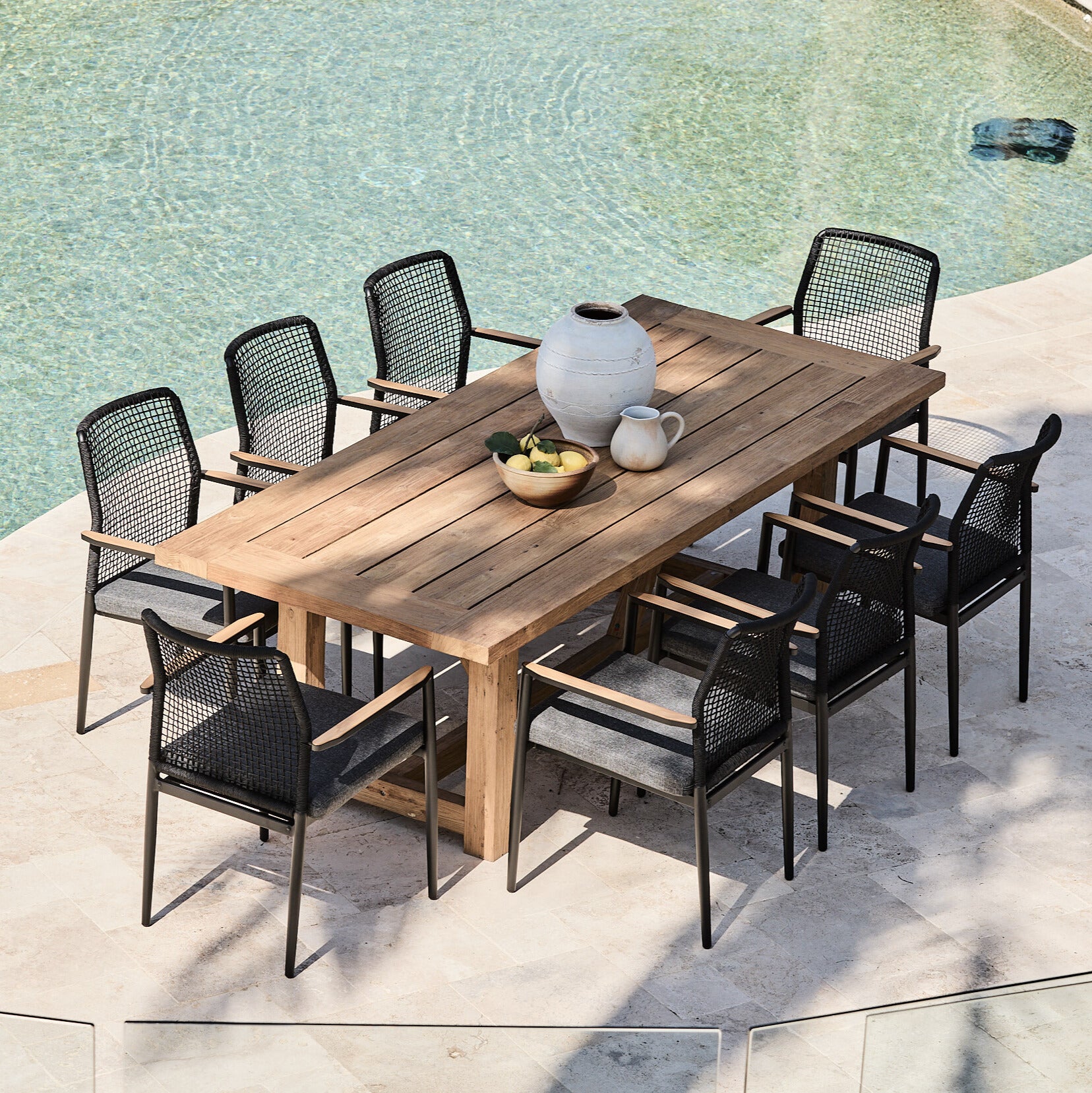 vinegard reclaimed teak outdoor table with black rope chairs