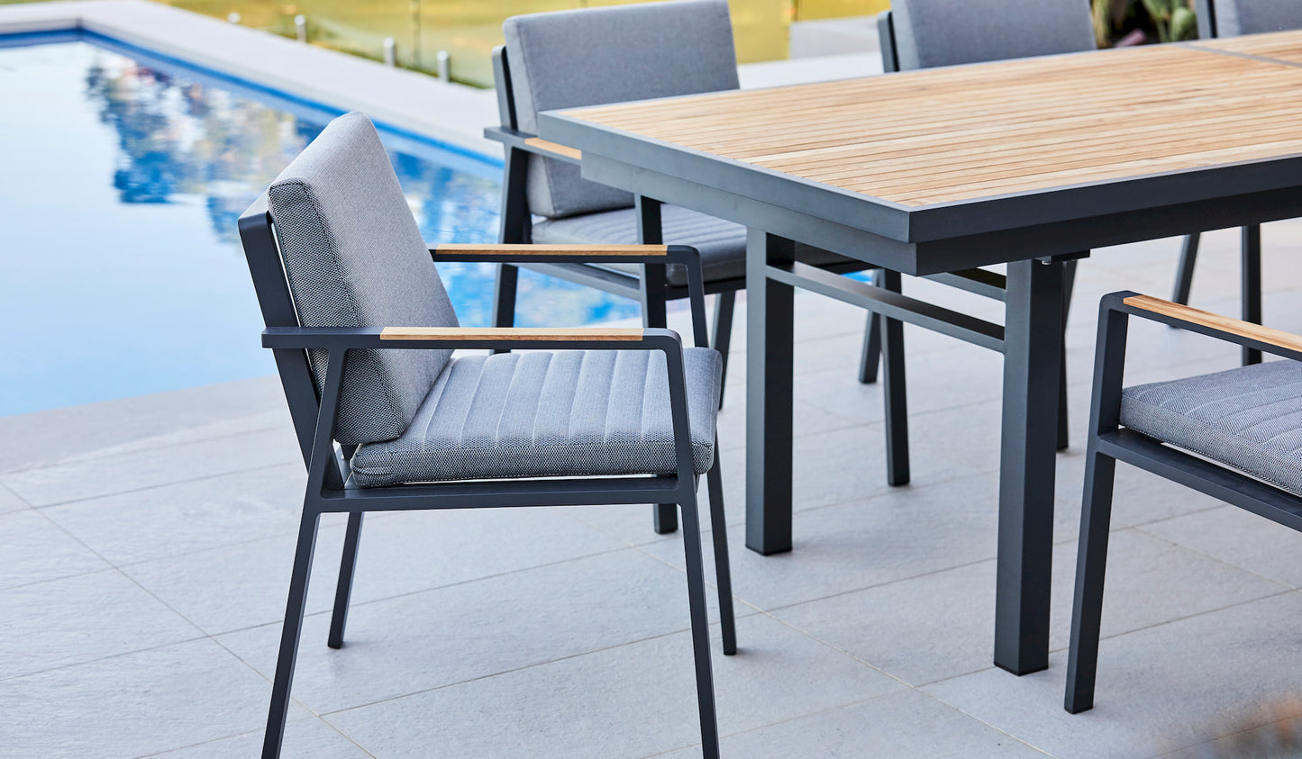 teak extension table with arm chairs